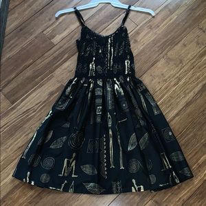 Black & gold patterned sleeveless dress